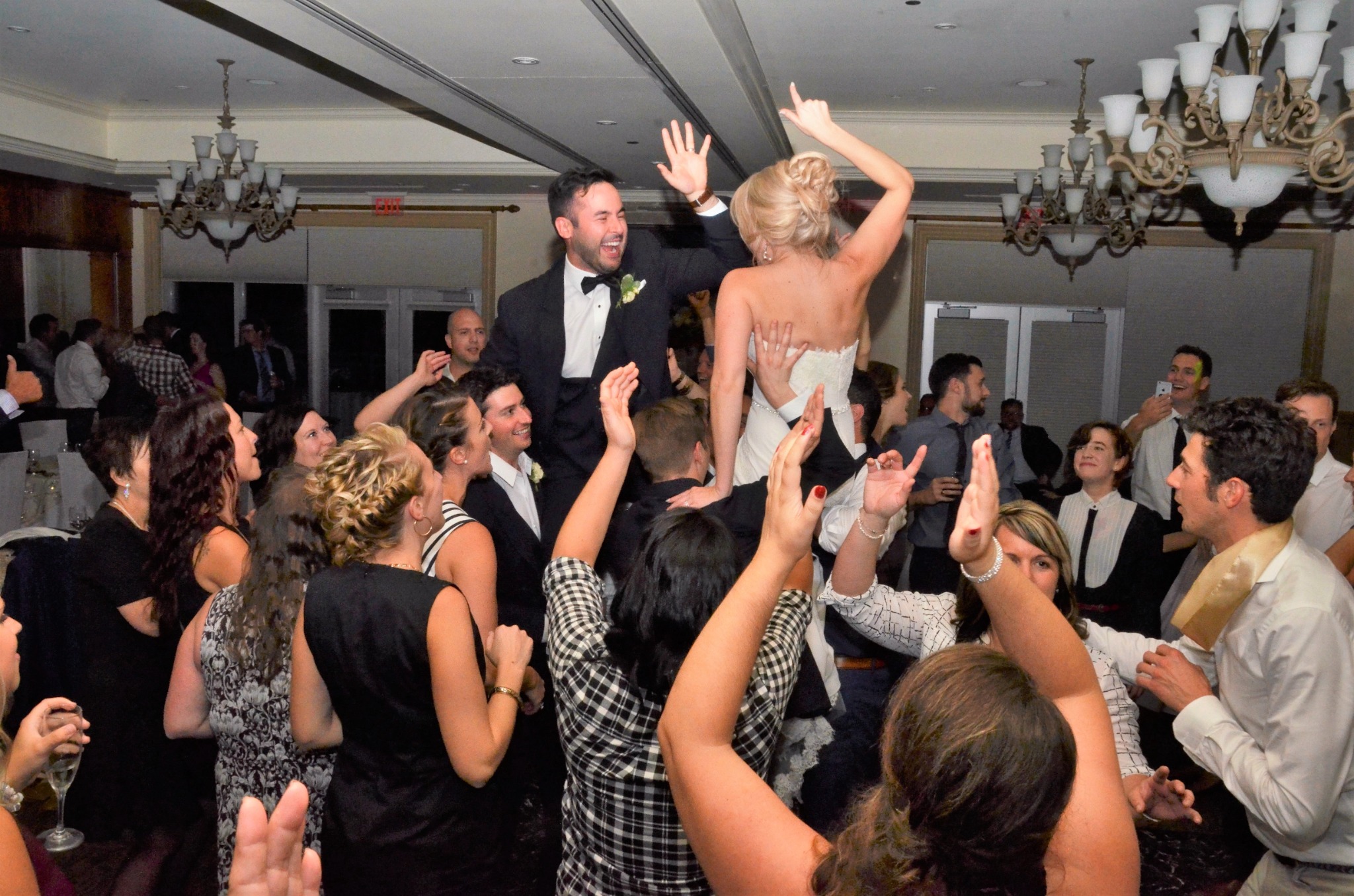 Wedding guests celebrating on the dance floor