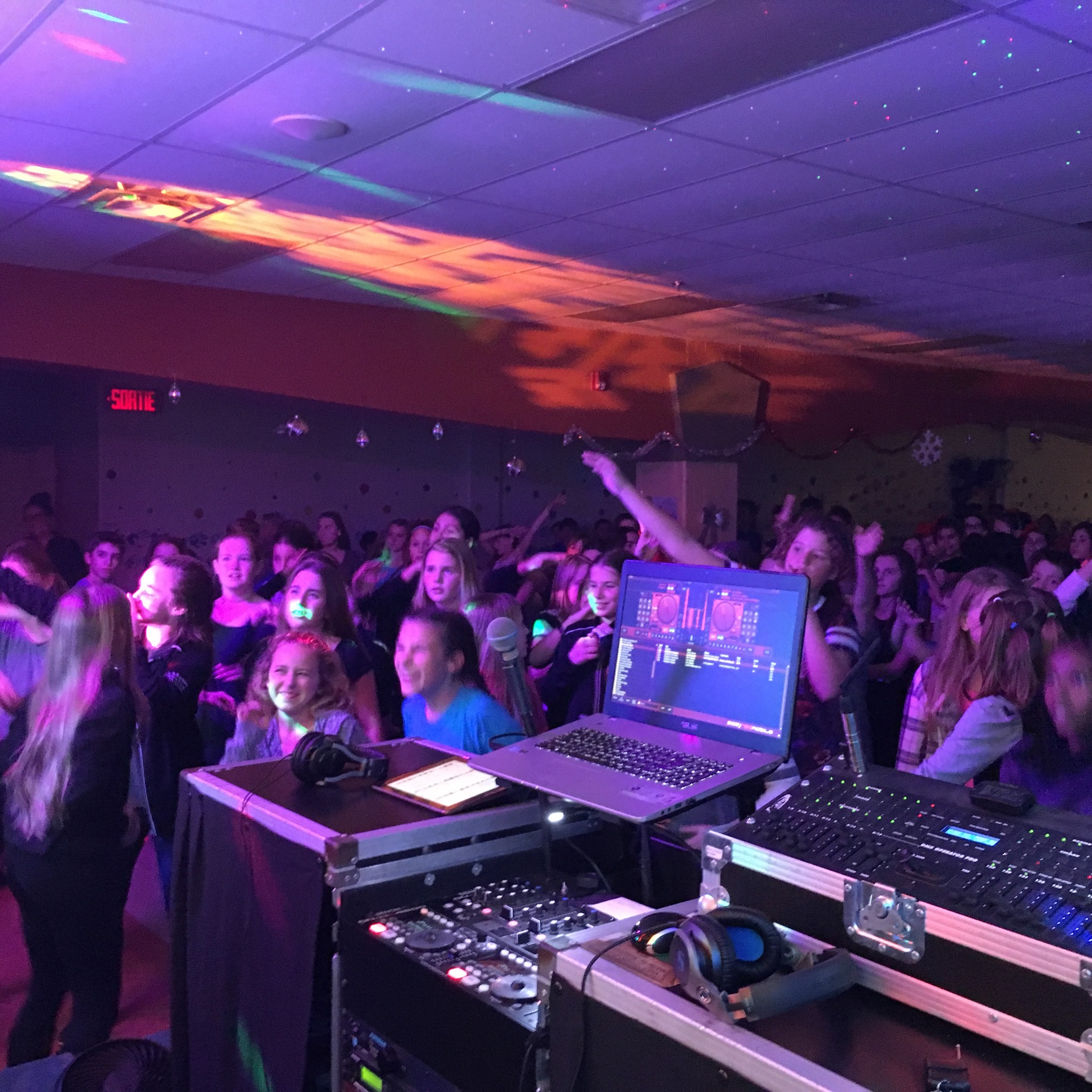 Teen dance with DJ equipment